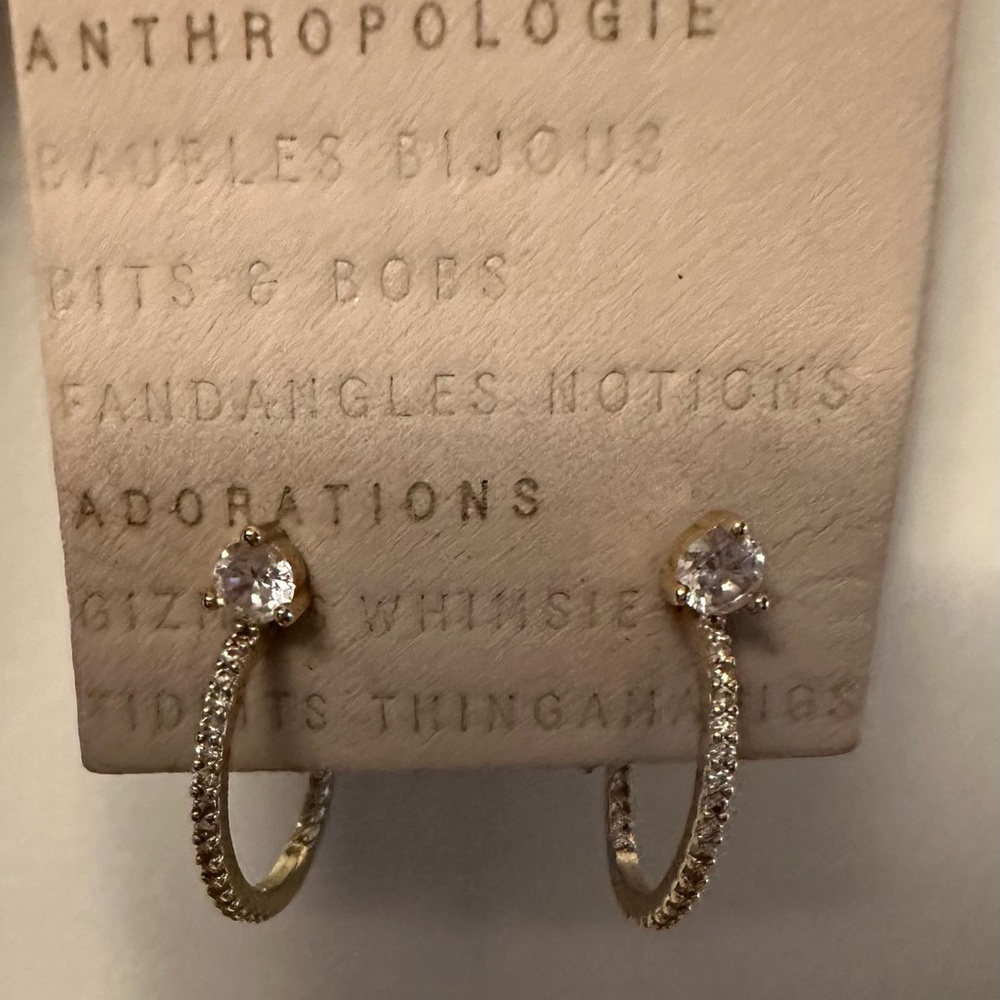 Never worn gold hoop earrings by Anthropologie.